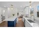 Open concept kitchen with quartz counters, an island, and modern light fixtures at 691 Gibson Nw Dr, Concord, NC 28025