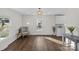 Elegant living room featuring hardwood floors, stylish decor, and abundant natural light at 691 Gibson Nw Dr, Concord, NC 28025