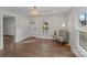 Bright and airy living room with hardwood floors, a stylish light fixture, and a cozy reading nook at 691 Gibson Nw Dr, Concord, NC 28025