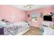 A delightful pink bedroom with bed, window and fun accents at 7436 Meridale Forest Dr, Charlotte, NC 28269