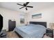 Cozy primary bedroom featuring a ceiling fan, large bed and ample closet space at 7436 Meridale Forest Dr, Charlotte, NC 28269