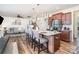 Open-concept kitchen with stainless appliances, granite countertops, and a spacious island at 7436 Meridale Forest Dr, Charlotte, NC 28269