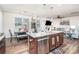 Kitchen with granite countertops, stainless appliances, pendant lights, open to the dining and living areas at 7436 Meridale Forest Dr, Charlotte, NC 28269