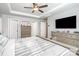 Comfortable main bedroom features a tray ceiling, ceiling fan, and neutral colors at 7436 Meridale Forest Dr, Charlotte, NC 28269