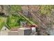 Aerial view of the home showcasing the backyard layout with a deck, patio, and fire pit at 7510 Plumcrest Ln, Harrisburg, NC 28075