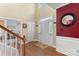 Bright foyer with hardwood floors, white trim, high ceilings, and a welcoming atmosphere at 7510 Plumcrest Ln, Harrisburg, NC 28075