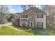 Beautiful two-story home with brick accents, well-maintained lawn, mature trees, and charming curb appeal at 7510 Plumcrest Ln, Harrisburg, NC 28075