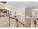Upstairs landing with wall decor and abundant natural light leading to multiple rooms at 7510 Plumcrest Ln, Harrisburg, NC 28075