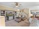 Spacious living room with a staircase, television, and comfortable seating perfect for relaxation and gatherings at 7510 Plumcrest Ln, Harrisburg, NC 28075