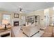 Inviting living room with a fireplace, built-in shelves, and a large television for entertainment at 7510 Plumcrest Ln, Harrisburg, NC 28075