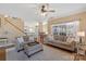 Open-concept living room with comfortable seating and a view of the kitchen and outdoor scenery at 7510 Plumcrest Ln, Harrisburg, NC 28075