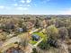 Aerial view of a home nestled among trees in a residential neighborhood at 9218 Robert Burns Ct, Charlotte, NC 28213