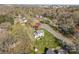 Aerial view of a home with a big yard nestled among trees in a residential neighborhood at 9218 Robert Burns Ct, Charlotte, NC 28213