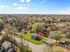 Aerial view of a home nestled among trees in a residential neighborhood at 9218 Robert Burns Ct, Charlotte, NC 28213