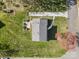 Aerial view of the property showing its layout, long driveway, landscaping, and surrounding greenery at 9218 Robert Burns Ct, Charlotte, NC 28213