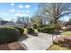 Backyard includes a concrete patio, mature trees, and access steps to the home at 9218 Robert Burns Ct, Charlotte, NC 28213