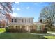 Traditional two-story brick home with well-maintained front yard and landscaping at 9218 Robert Burns Ct, Charlotte, NC 28213