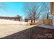 Private fenced backyard with a wooden fence and patio is perfect for outdoor activities and enjoying the surrounding scenery at 945 3Rd Street Sw Pl, Hickory, NC 28602