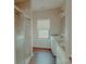 Bathroom featuring granite counters, double sinks, and tiled walk-in shower at 945 3Rd Street Sw Pl, Hickory, NC 28602