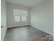 Well-lit bedroom with a large window and sleek floors, offering a cozy and modern feel at 945 3Rd Street Sw Pl, Hickory, NC 28602