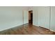 Bedroom with hardwood floors, a closet, and an entry way to another room at 945 3Rd Street Sw Pl, Hickory, NC 28602