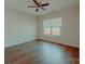 Bright bedroom features a ceiling fan and warm, wood-look flooring at 945 3Rd Street Sw Pl, Hickory, NC 28602