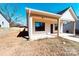 New construction featuring white siding, a covered porch with craftsman columns, and a bright blue front door at 945 3Rd Street Sw Pl, Hickory, NC 28602