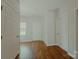 Inviting hallway with sleek floors, neutral paint, and multiple doors leading to various rooms at 945 3Rd Street Sw Pl, Hickory, NC 28602