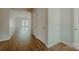 Hallway featuring hardwood floors, white trim, and access to a living area at 945 3Rd Street Sw Pl, Hickory, NC 28602