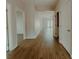 Hallway featuring hardwood floors, white trim, and multiple entryways to rooms at 945 3Rd Street Sw Pl, Hickory, NC 28602