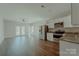 Spacious living room features modern stainless steel appliances, access to the backyard, and seamlessly connects to the kitchen at 945 3Rd Street Sw Pl, Hickory, NC 28602