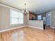 Bright dining area featuring hardwood floors and a stylish chandelier at 10133 Caldwell Forest Rd, Charlotte, NC 28213