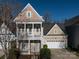 Charming two-story home with a welcoming porch and a two-car garage at 10133 Caldwell Forest Rd, Charlotte, NC 28213