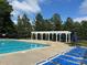 Community pool with plenty of seating and shade. Perfect for relaxing poolside at 10133 Caldwell Forest Rd, Charlotte, NC 28213