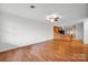 Spacious living room with gleaming hardwood floors and modern ceiling fan at 118 Ashleigh Ct, Fort Mill, SC 29715