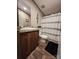 Bathroom featuring a wood-look vanity, toilet, and shower with curtain at 119 Jack Adams Rd, Kings Mountain, NC 28086
