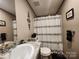 Bathroom with vanity, toilet, shower with striped curtain, and coordinated decor at 119 Jack Adams Rd, Kings Mountain, NC 28086