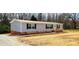 Charming single-story home with gray siding, black shutters, and a well-maintained yard at 119 Jack Adams Rd, Kings Mountain, NC 28086