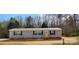 Single-story home with gray siding, black shutters, and a well-maintained yard at 119 Jack Adams Rd, Kings Mountain, NC 28086