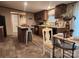 A functional kitchen with a center island, warm wood cabinetry, and eat-in dining space at 119 Jack Adams Rd, Kings Mountain, NC 28086
