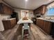 Well-equipped kitchen with an island bar, modern appliances, and wood cabinets at 119 Jack Adams Rd, Kings Mountain, NC 28086