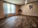 Spacious living room with neutral walls, large windows, and stylish patterned curtains at 119 Jack Adams Rd, Kings Mountain, NC 28086
