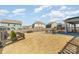 Large backyard with a fire pit, picnic table, and a view of surrounding homes at 123 Clauser N Rd, Mount Holly, NC 28120