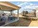 View of the backyard featuring a trampoline and outdoor seating area under the covered patio at 123 Clauser N Rd, Mount Holly, NC 28120