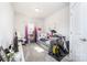 Organized bedroom featuring a daybed, a desk and exercise equipment at 123 Clauser N Rd, Mount Holly, NC 28120