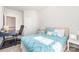 Light and airy bedroom featuring a modern desk and a blue patterned bedspread at 123 Clauser N Rd, Mount Holly, NC 28120