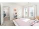 Light filled bedroom featuring white furniture, neutral carpet and large windows at 123 Clauser N Rd, Mount Holly, NC 28120