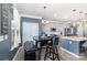 Cozy dining area adjacent to the kitchen features pendant lighting and a modern table and seating at 123 Clauser N Rd, Mount Holly, NC 28120