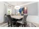 Bright dining area featuring stylish decor, statement light fixture, and modern wall art at 123 Clauser N Rd, Mount Holly, NC 28120