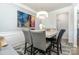 Bright dining room featuring stylish table, statement light fixture, and modern wall art at 123 Clauser N Rd, Mount Holly, NC 28120